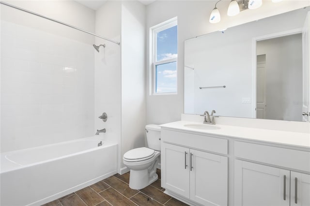 full bath featuring  shower combination, wood finish floors, vanity, and toilet