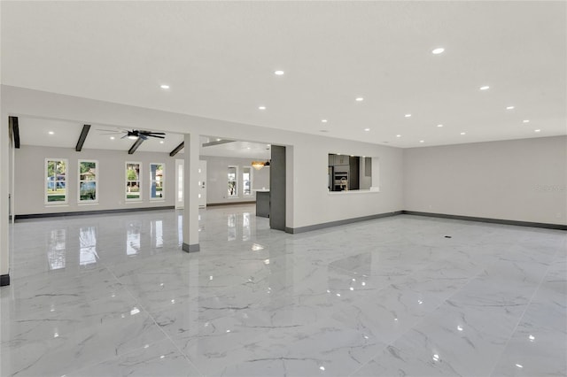 unfurnished living room featuring vaulted ceiling with beams and ceiling fan