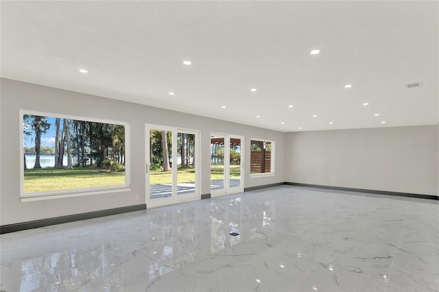 unfurnished living room with a healthy amount of sunlight