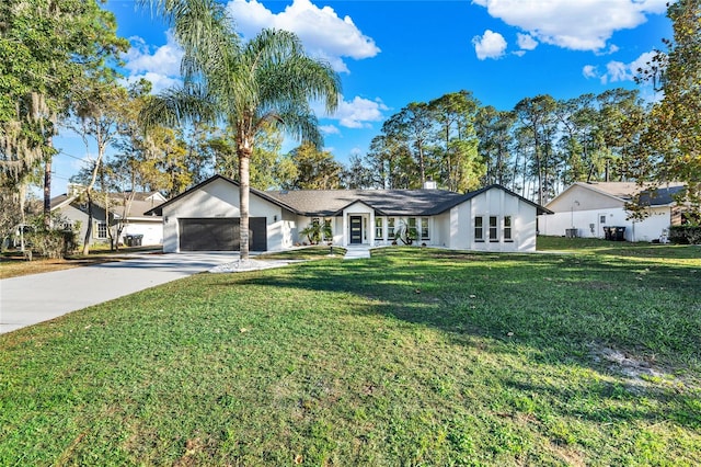 single story home with a garage and a front yard