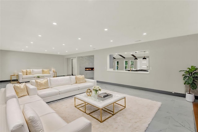 living room featuring a fireplace