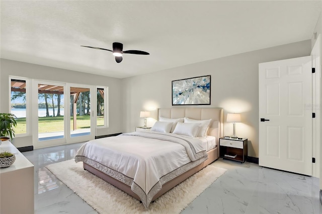 bedroom with ceiling fan, a textured ceiling, and access to outside