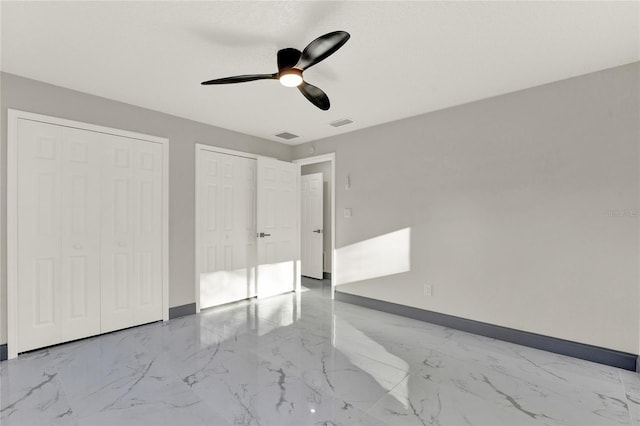 unfurnished bedroom featuring ceiling fan