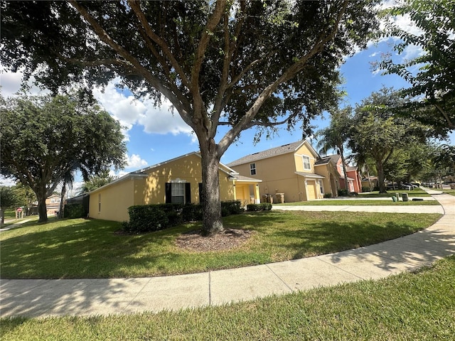 ranch-style home featuring a front yard