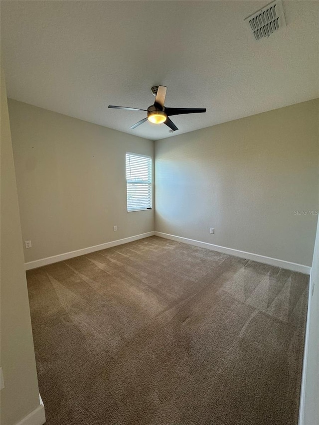 carpeted empty room with ceiling fan