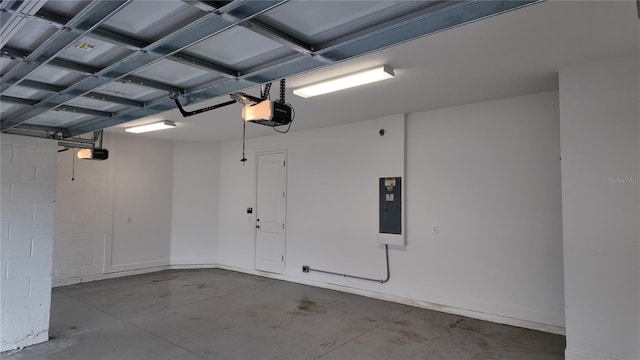 garage with electric panel and a garage door opener