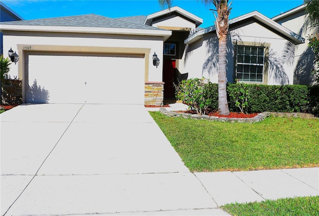 1569 Thetford Cir, Orlando, FL 32824 - single story home featuring a garage, driveway, stucco siding, a front yard, and a shingled roof