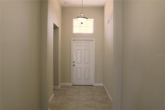 1569 Thetford Cir, Orlando, FL 32824 - entryway featuring light tile patterned floors and baseboards