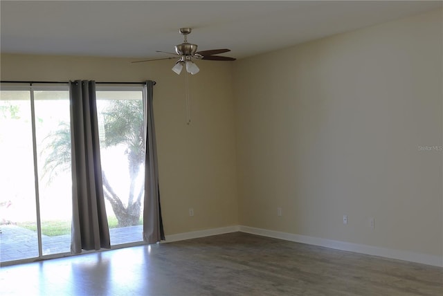 1569 Thetford Cir, Orlando, FL 32824 - empty room with wood finished floors, a ceiling fan, and baseboards