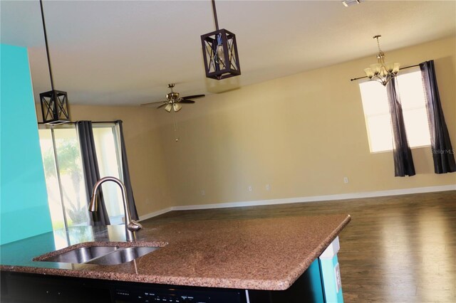 1569 Thetford Cir, Orlando, FL 32824 - kitchen featuring a sink, healthy amount of natural light, open floor plan, and dark wood finished floors