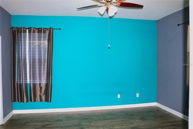 empty room featuring ceiling fan, dark hardwood / wood-style flooring, and a textured ceiling