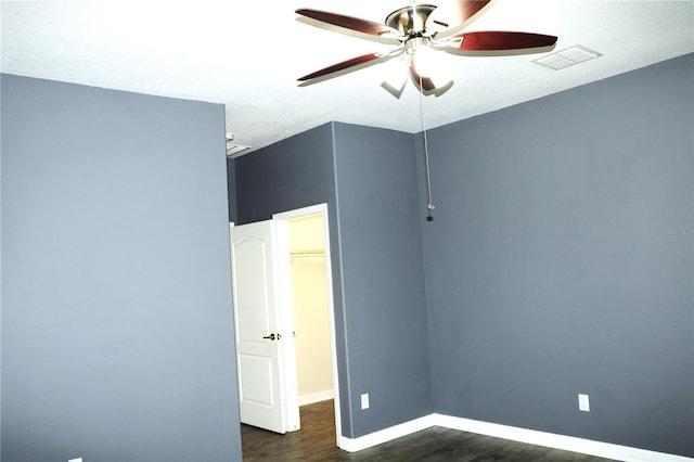 1569 Thetford Cir, Orlando, FL 32824 - spare room featuring wood finished floors, a ceiling fan, and baseboards