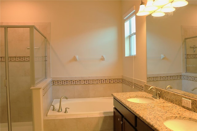 bathroom featuring vanity and shower with separate bathtub