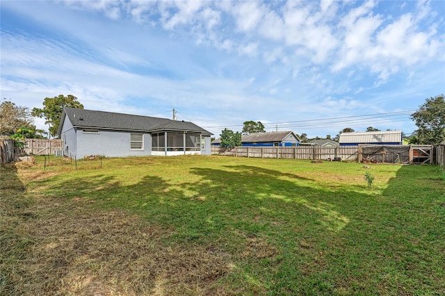 view of yard with a sunroom