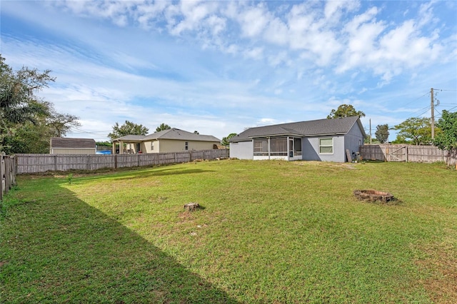 view of yard featuring a sunroom