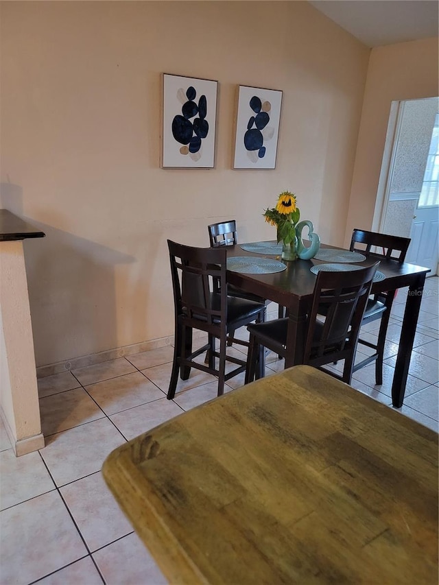 566/568 Imperial Pl, Kissimmee, FL 34758 - dining room featuring light tile patterned flooring and baseboards