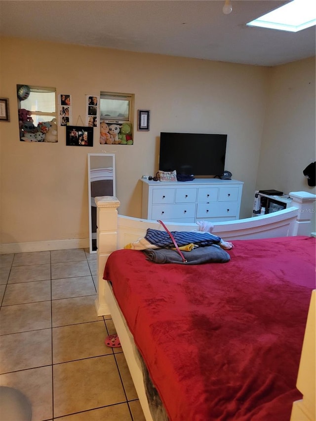 566/568 Imperial Pl, Kissimmee, FL 34758 - bedroom featuring light tile patterned flooring and a skylight