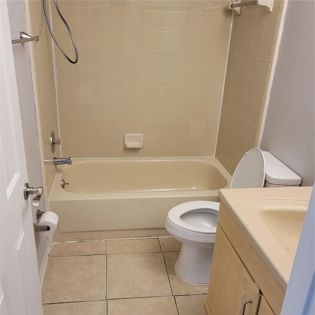 566/568 Imperial Pl, Kissimmee, FL 34758 - bathroom with toilet, vanity, tile patterned floors, and shower / tub combination