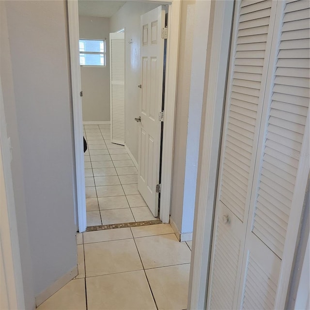 566/568 Imperial Pl, Kissimmee, FL 34758 - corridor with light tile patterned floors and baseboards