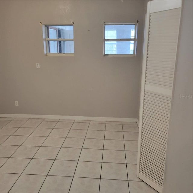 566/568 Imperial Pl, Kissimmee, FL 34758 - empty room featuring light tile patterned flooring and baseboards