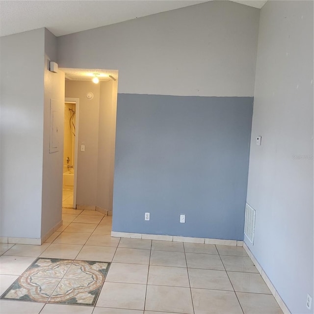 566/568 Imperial Pl, Kissimmee, FL 34758 - spare room featuring light tile patterned floors and baseboards