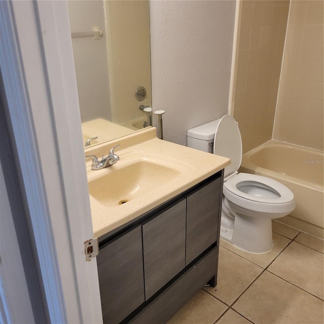566/568 Imperial Pl, Kissimmee, FL 34758 - bathroom with vanity, tile patterned flooring, toilet,  shower combination, and a textured wall