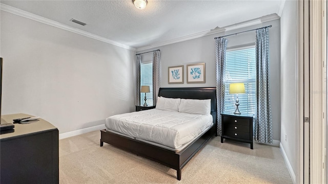 carpeted bedroom featuring crown molding and a textured ceiling