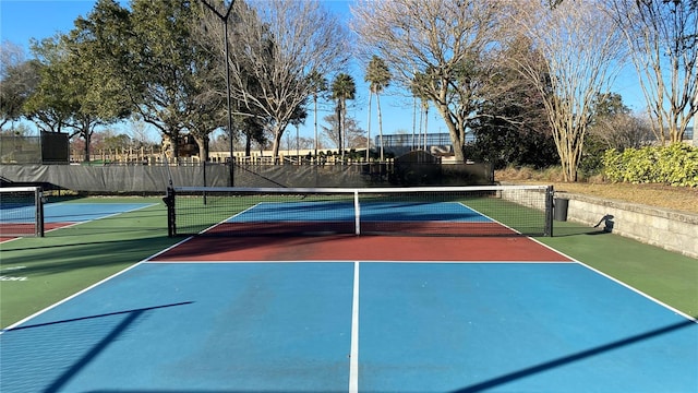 view of tennis court featuring basketball court