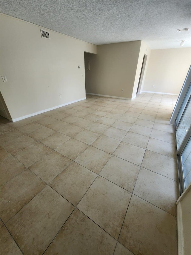 empty room with a textured ceiling