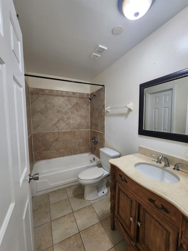 full bathroom with tile patterned flooring, vanity, toilet, and tiled shower / bath combo