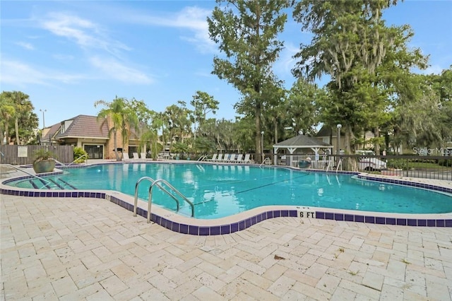 view of swimming pool featuring a patio