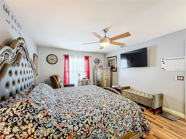 bedroom featuring ceiling fan and hardwood / wood-style flooring