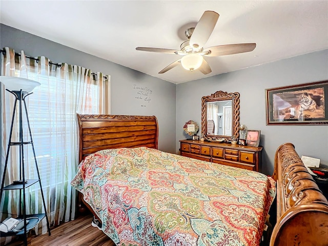 bedroom with ceiling fan and wood-type flooring