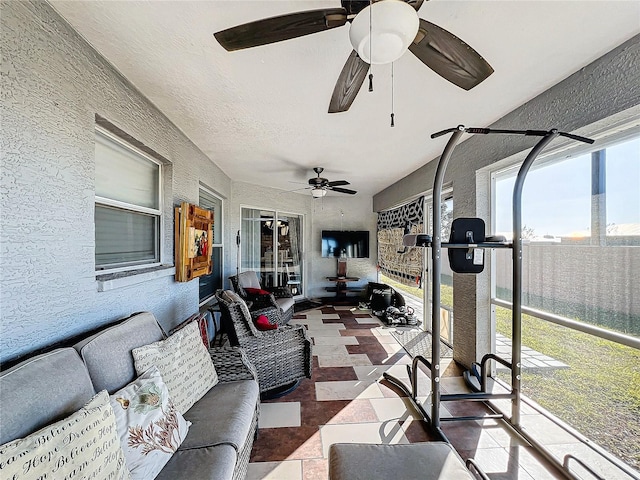 sunroom / solarium with ceiling fan