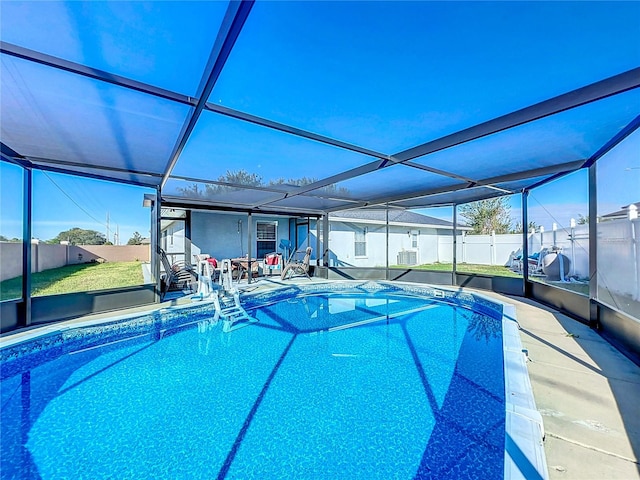 view of pool with a lanai and a patio area