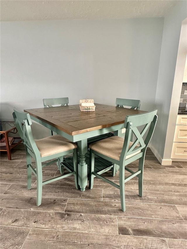 dining area featuring hardwood / wood-style floors