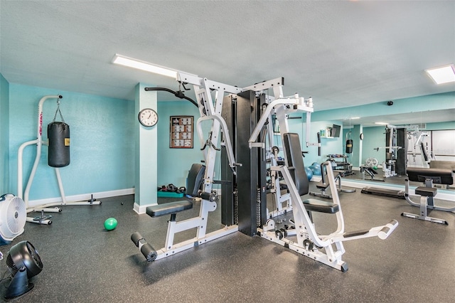 workout area with a textured ceiling