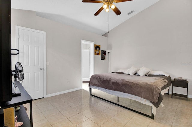 bedroom with ceiling fan, light tile patterned floors, and vaulted ceiling