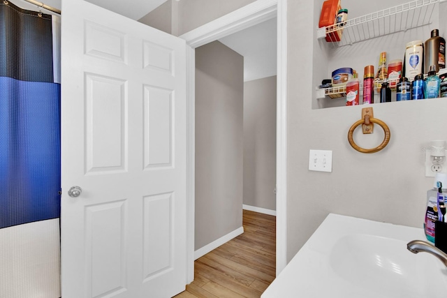 bathroom featuring hardwood / wood-style flooring and sink