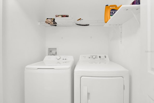 laundry area with washing machine and dryer