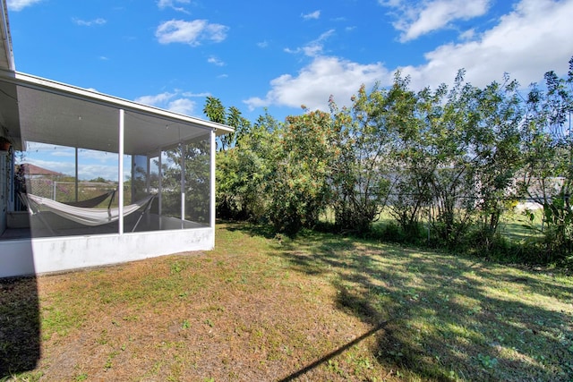 view of yard with a sunroom