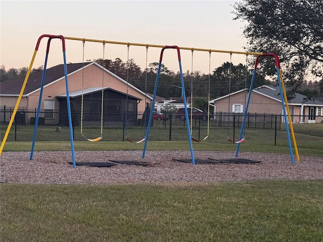 playground at dusk with a lawn