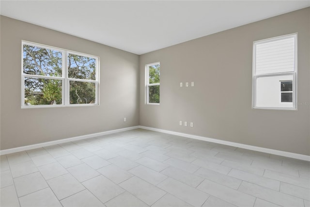 spare room with light tile patterned flooring