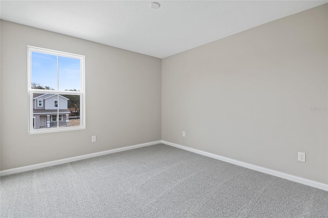 unfurnished room with carpet floors