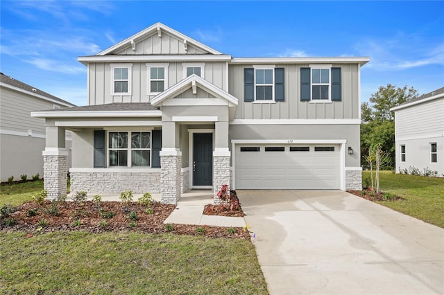 craftsman-style house with a garage and a front lawn