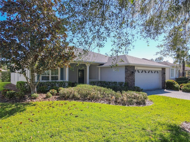 single story home featuring a garage and a front lawn