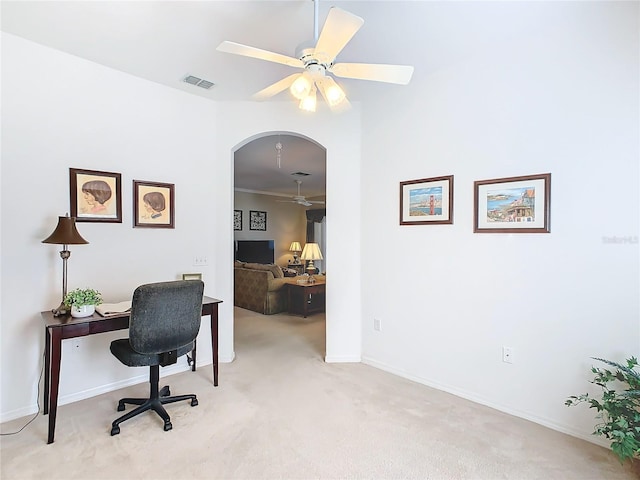 carpeted home office featuring ceiling fan