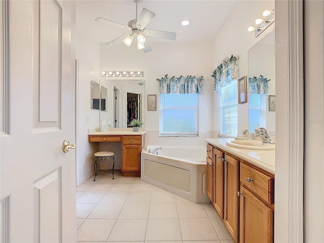 bathroom with a tub, ceiling fan, tile patterned flooring, and vanity