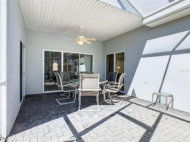 view of patio featuring ceiling fan