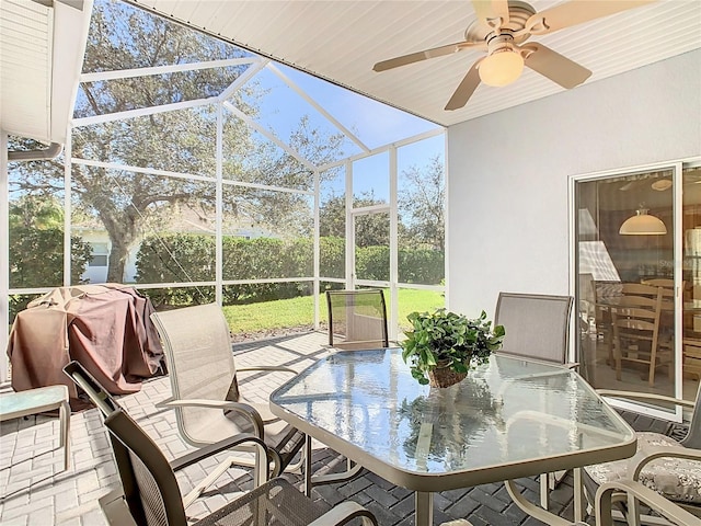 sunroom featuring vaulted ceiling